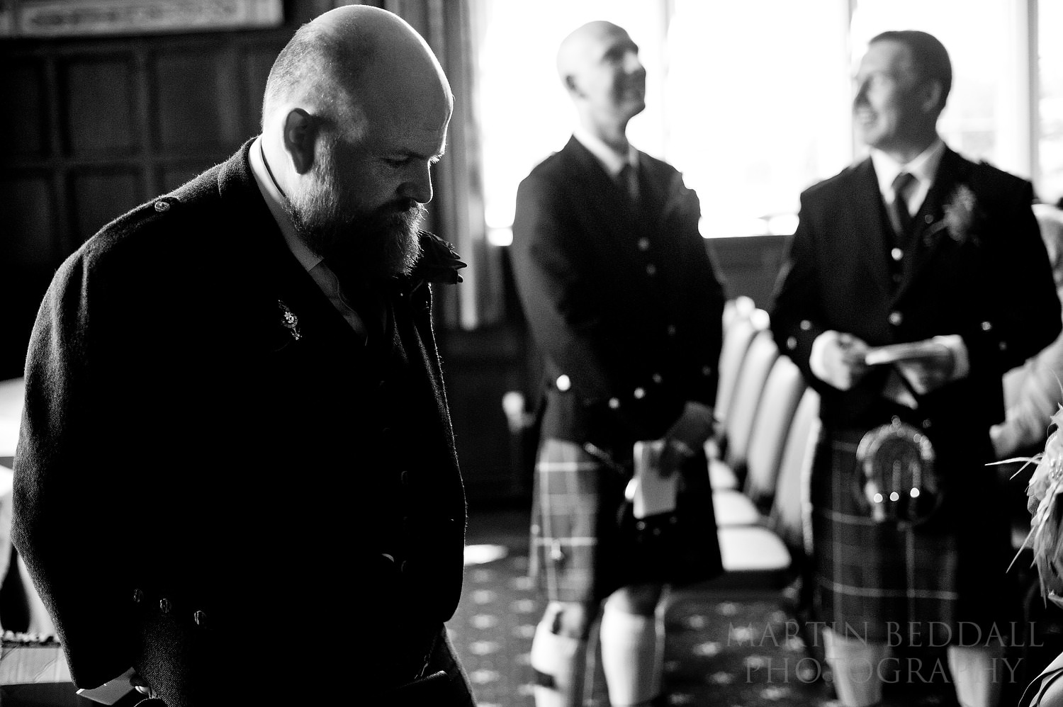 Nervous groom in the ceremony room at Bisham Abbey