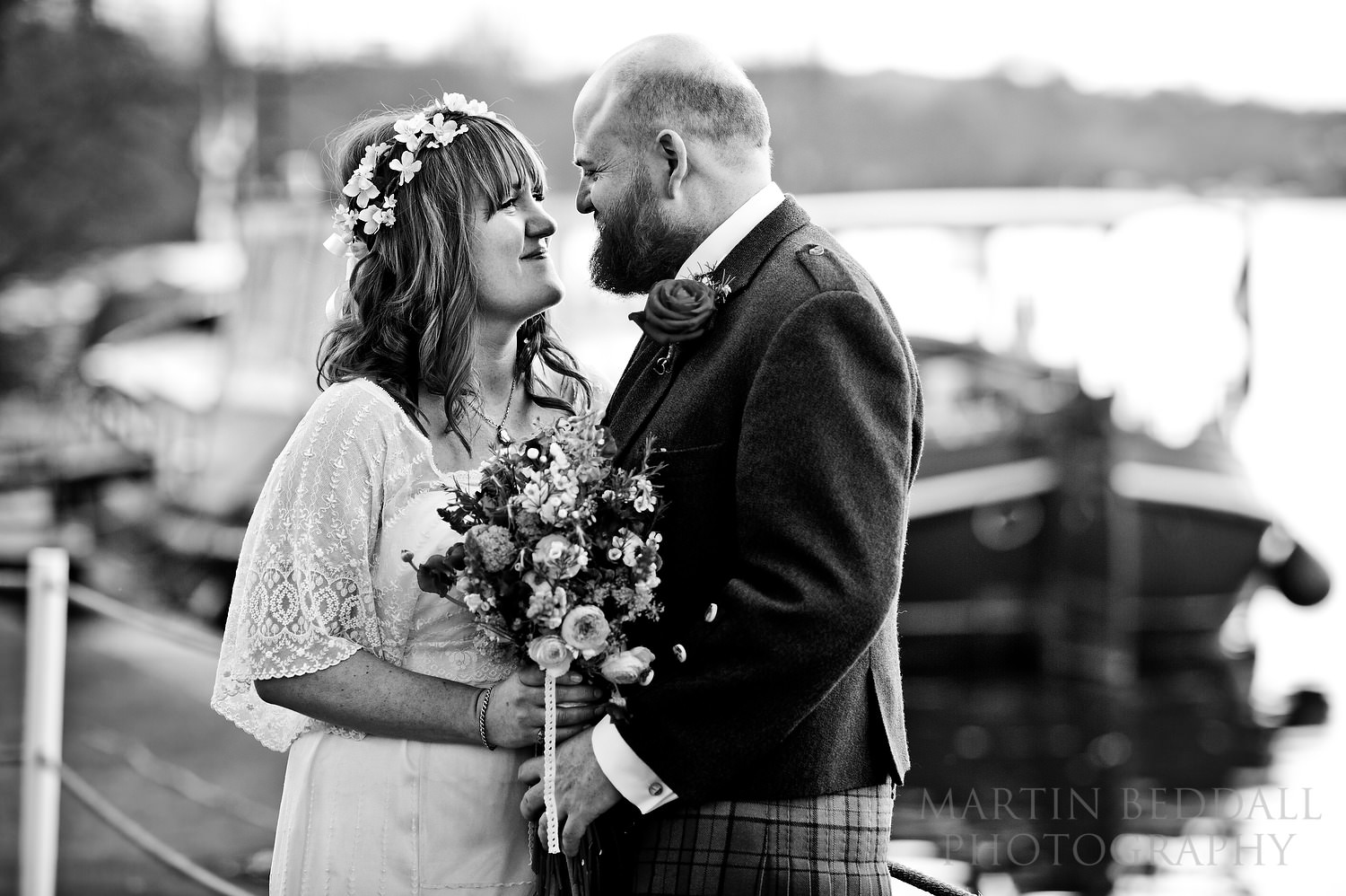 Bride and groom porait by the river Thames at Bisham Abbey wedding