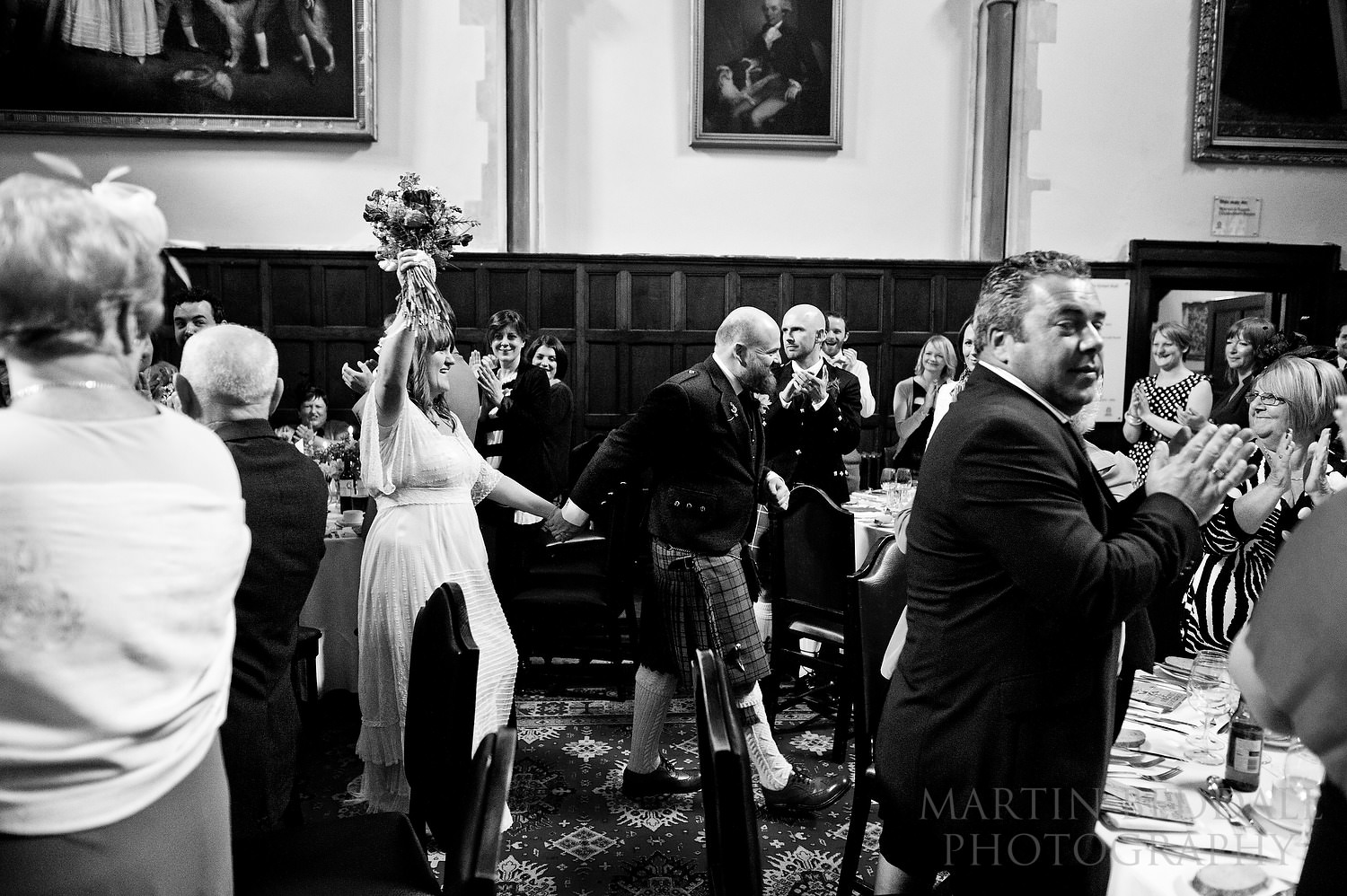 Bride and groom enter dinner at Bisham Abbey wedding