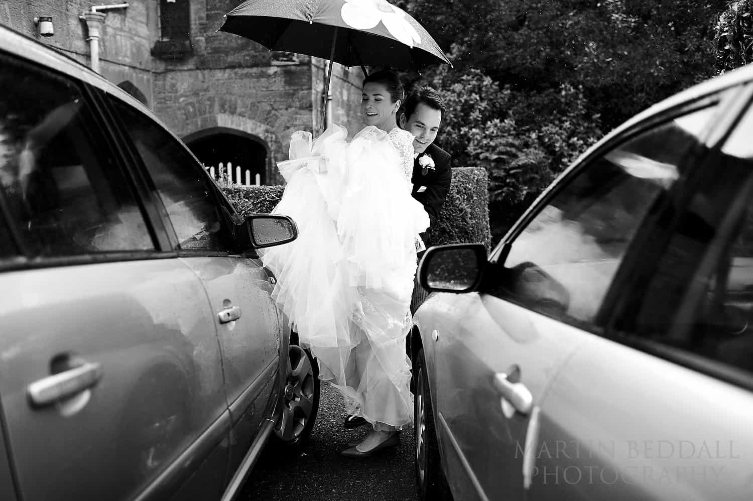 Getting the wedding dress past the parked cars