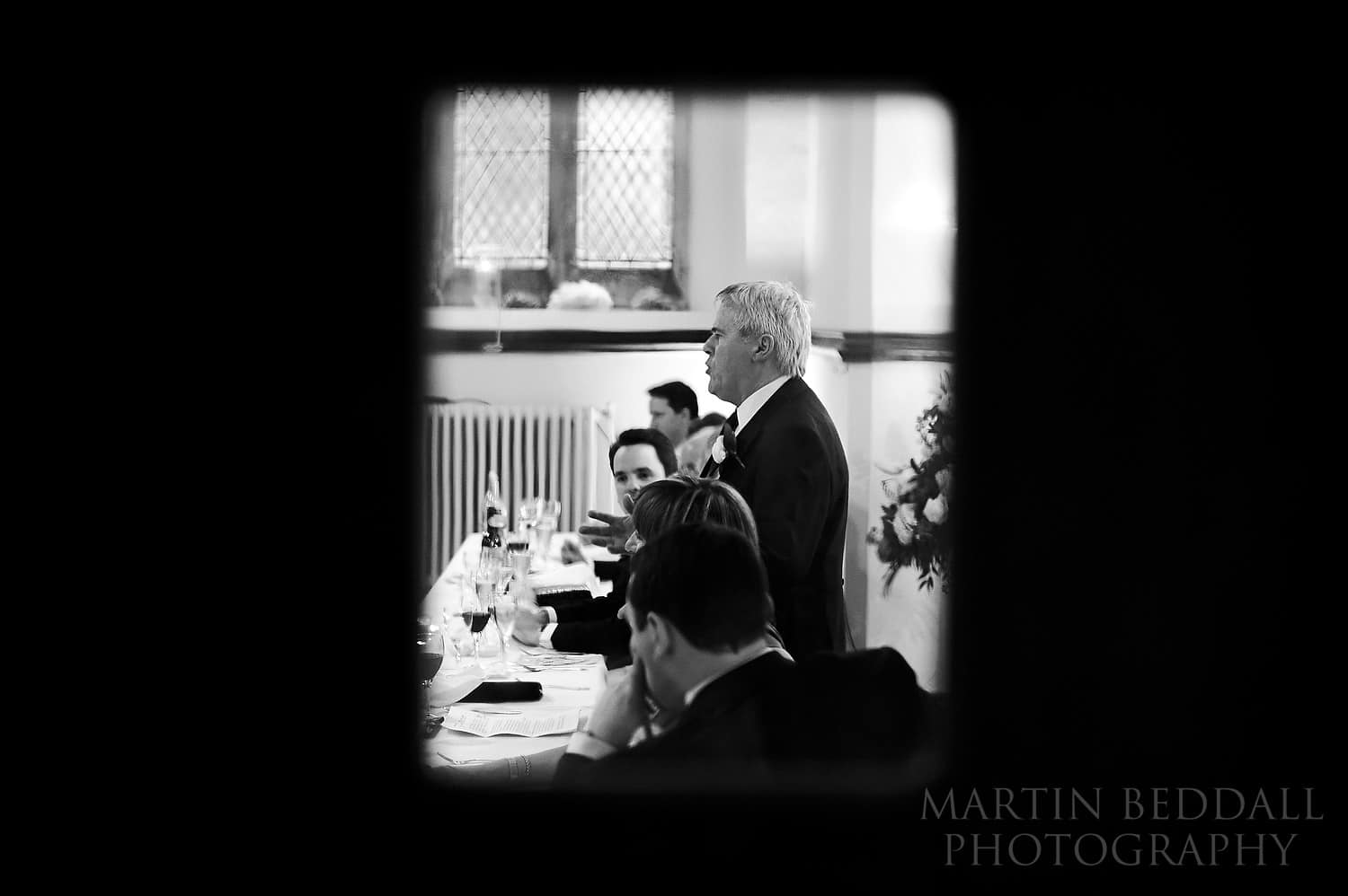 Bride's father speech seen through a door at mayfield school