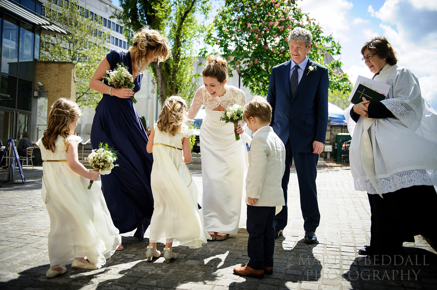 Bride greets the waiting flower girls