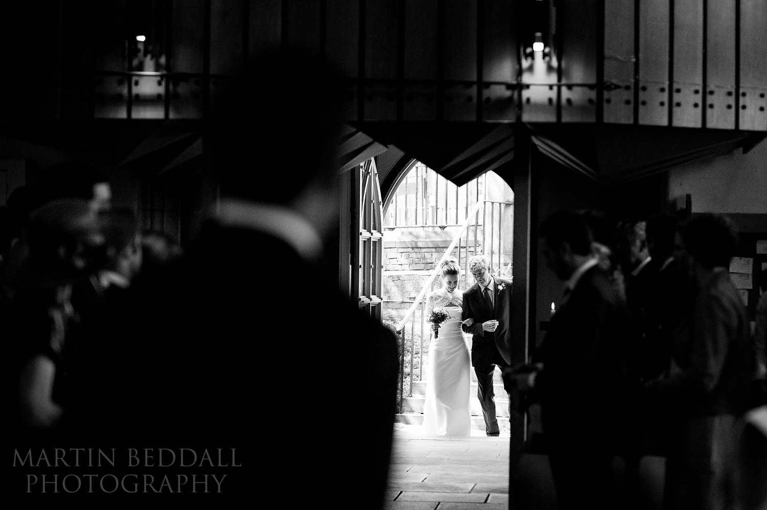 Bride enters St Mary the Virgin church in Putney