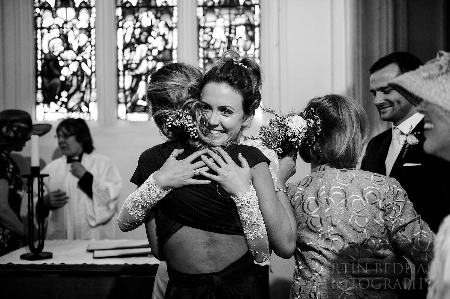 Bride and her sister hug