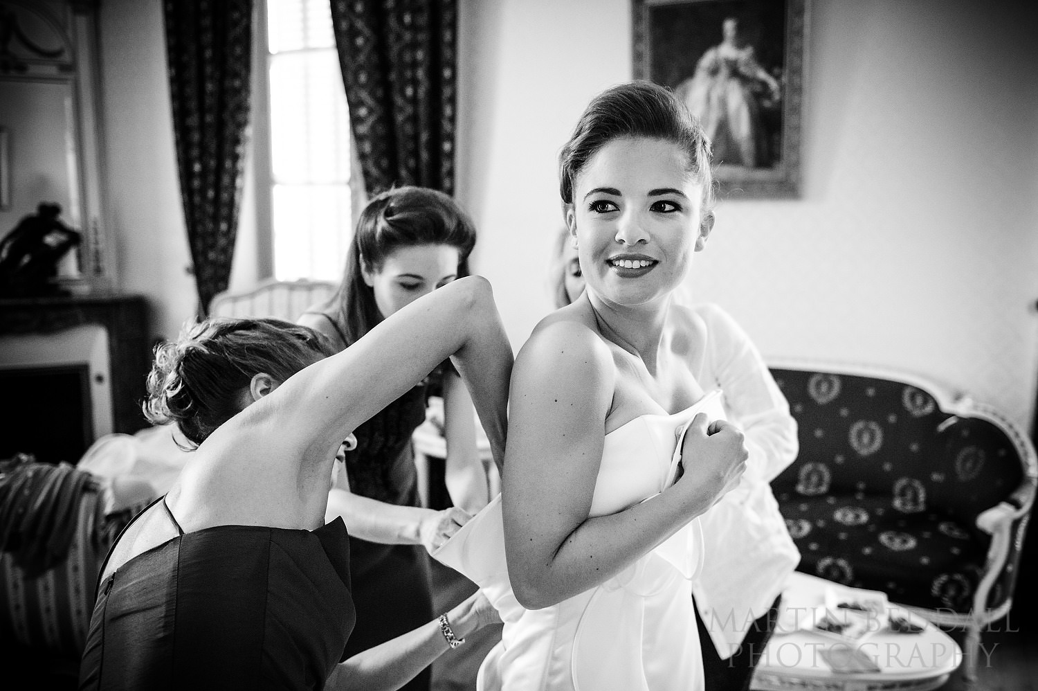 Wedding dress going on at Anglo-French wedding