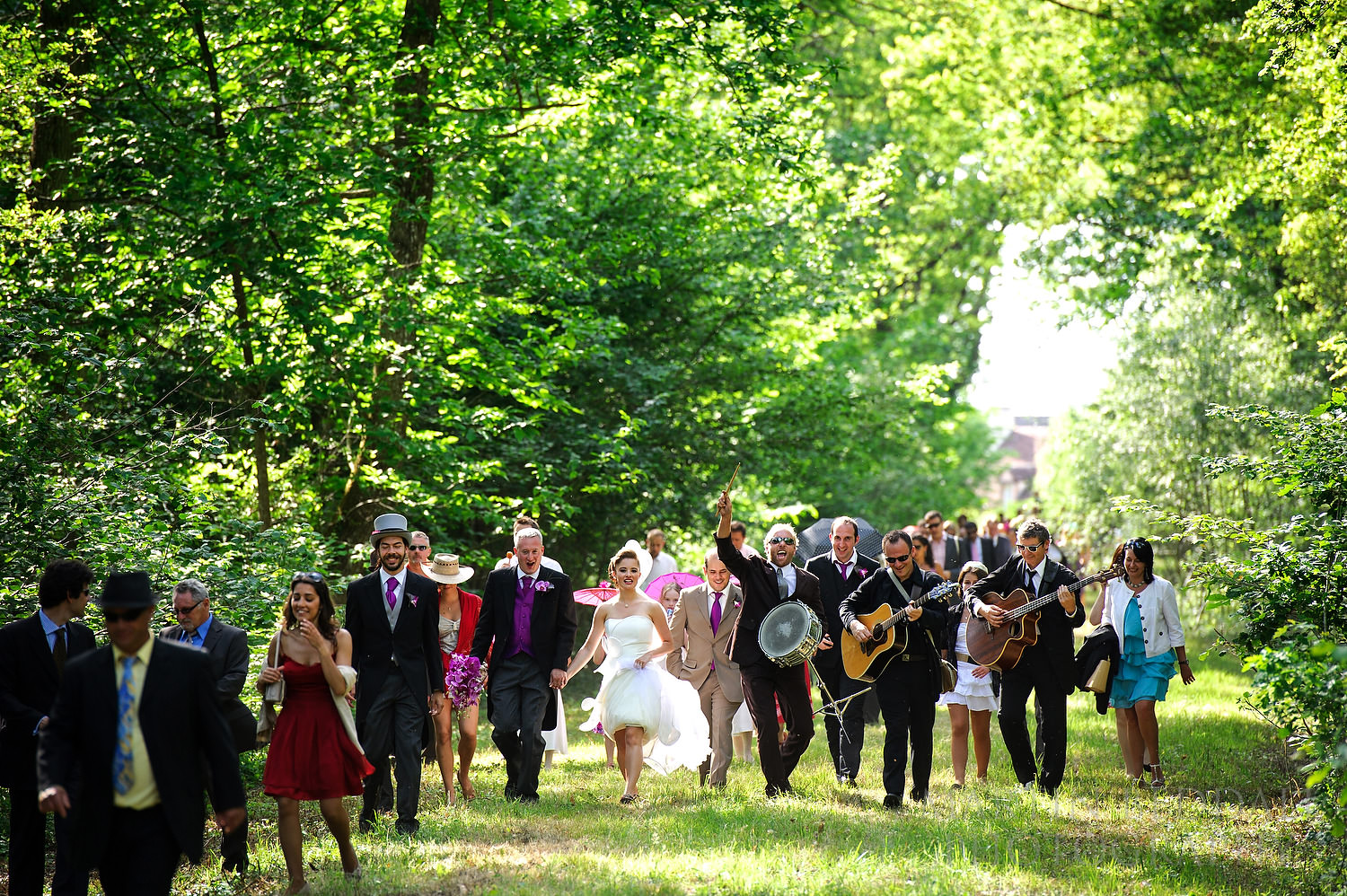 Wedding party walks back from the village to Chateau Villette
