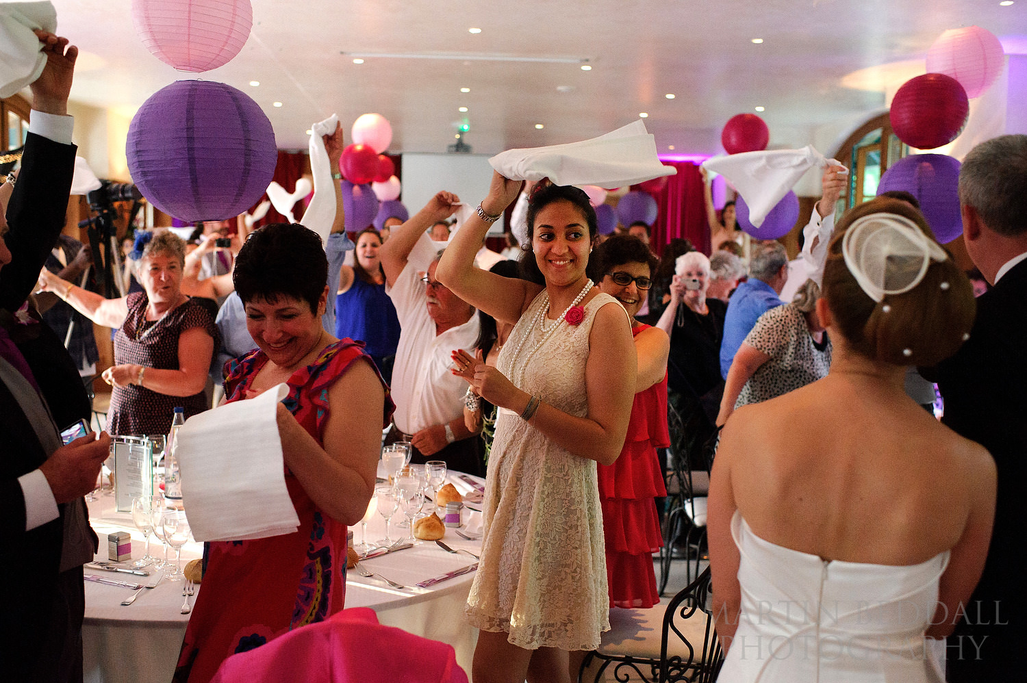 Waving napkins aas the bride and groom enter for dinner