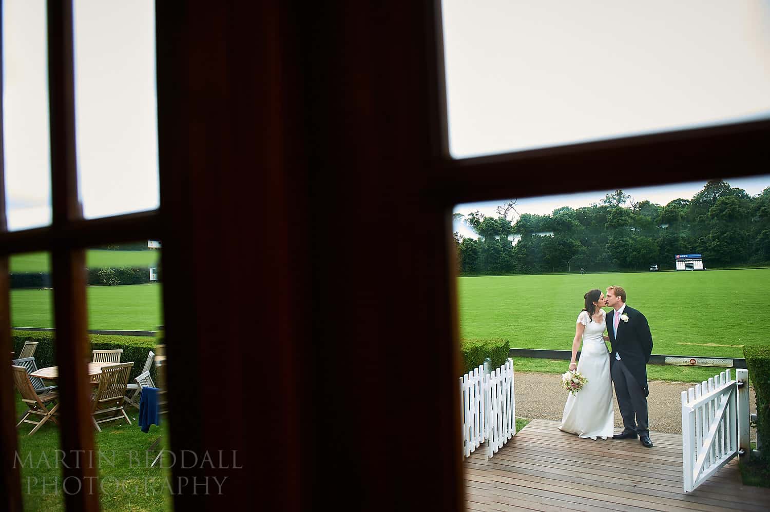 Bride and groom await to come into dinner at Ham polo club