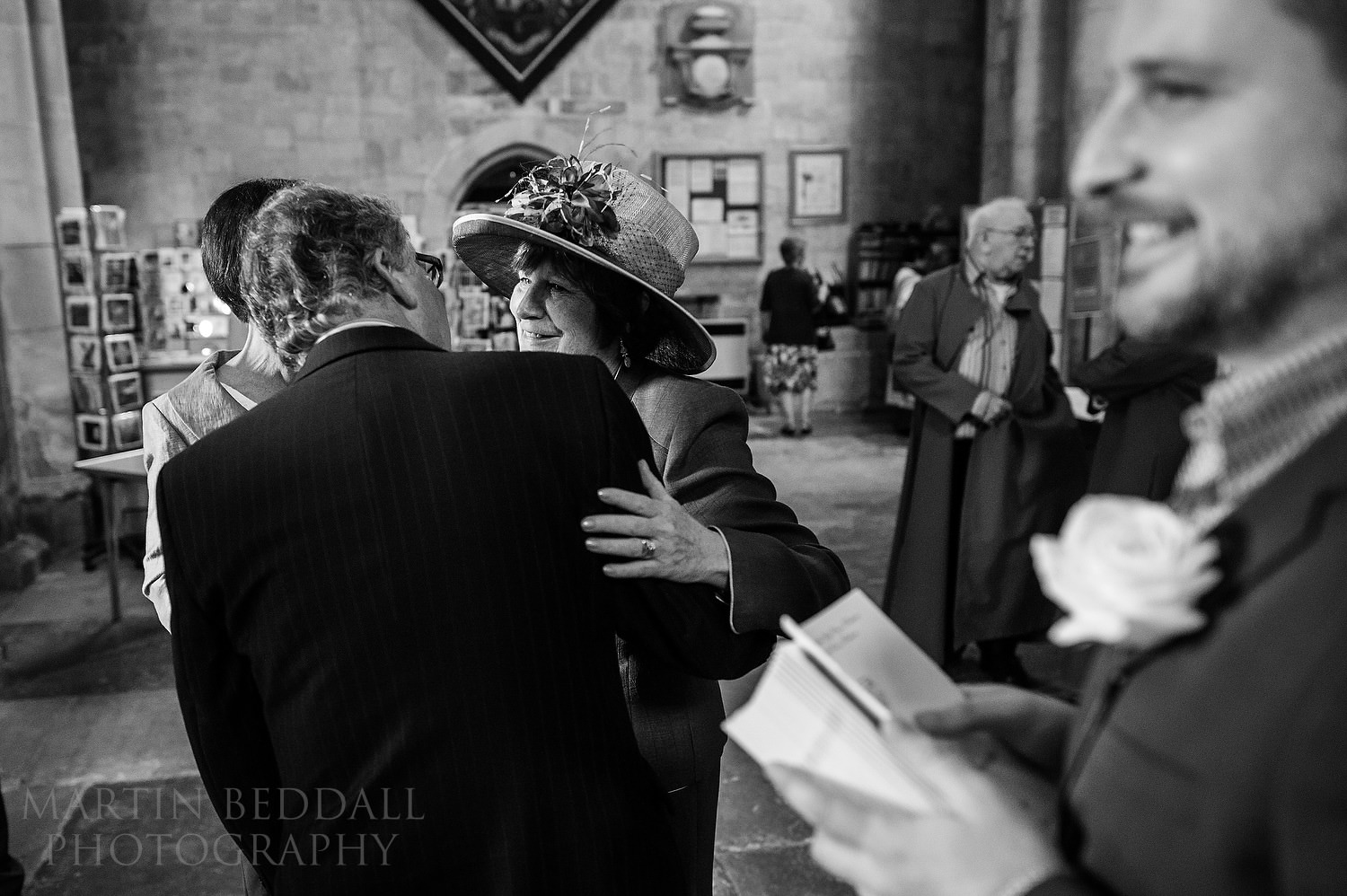 Greeting wedding guests in Pershore Abbey