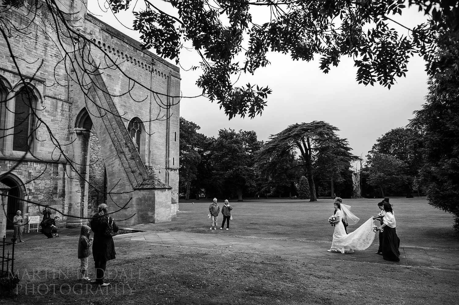 Bride walks towards Pershore Abbey