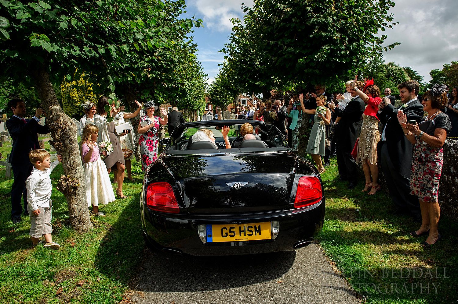 Wedding car leaves the church