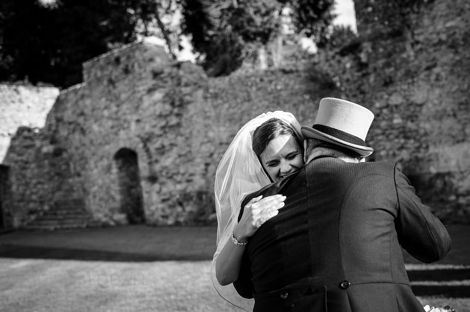 Guest hugs the bride