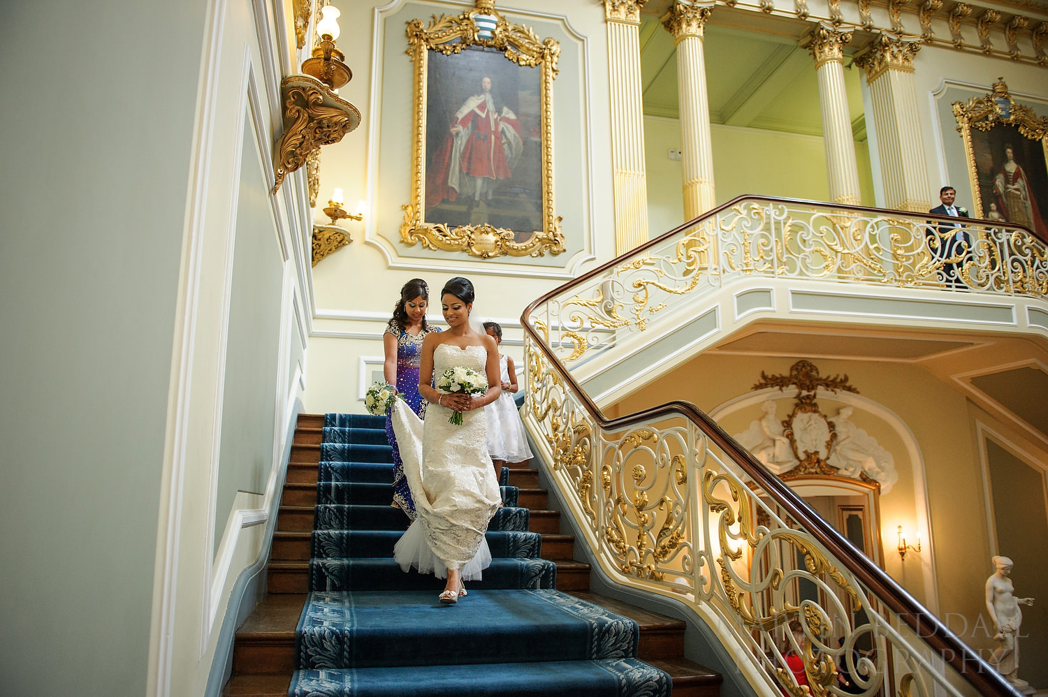 Bride descends the stairs at Wrest Park