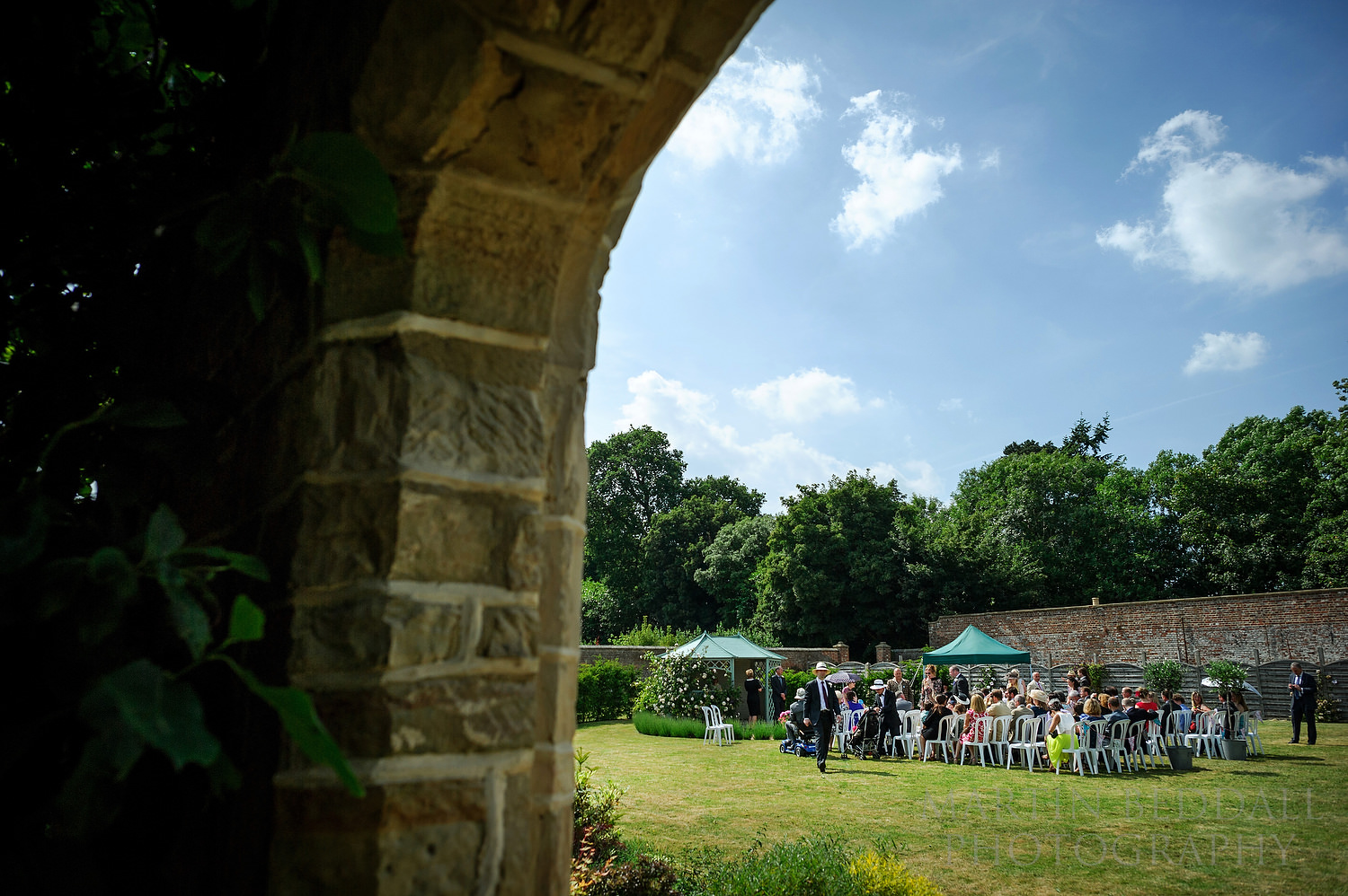 Guests take their seats fro the wedding ceremony