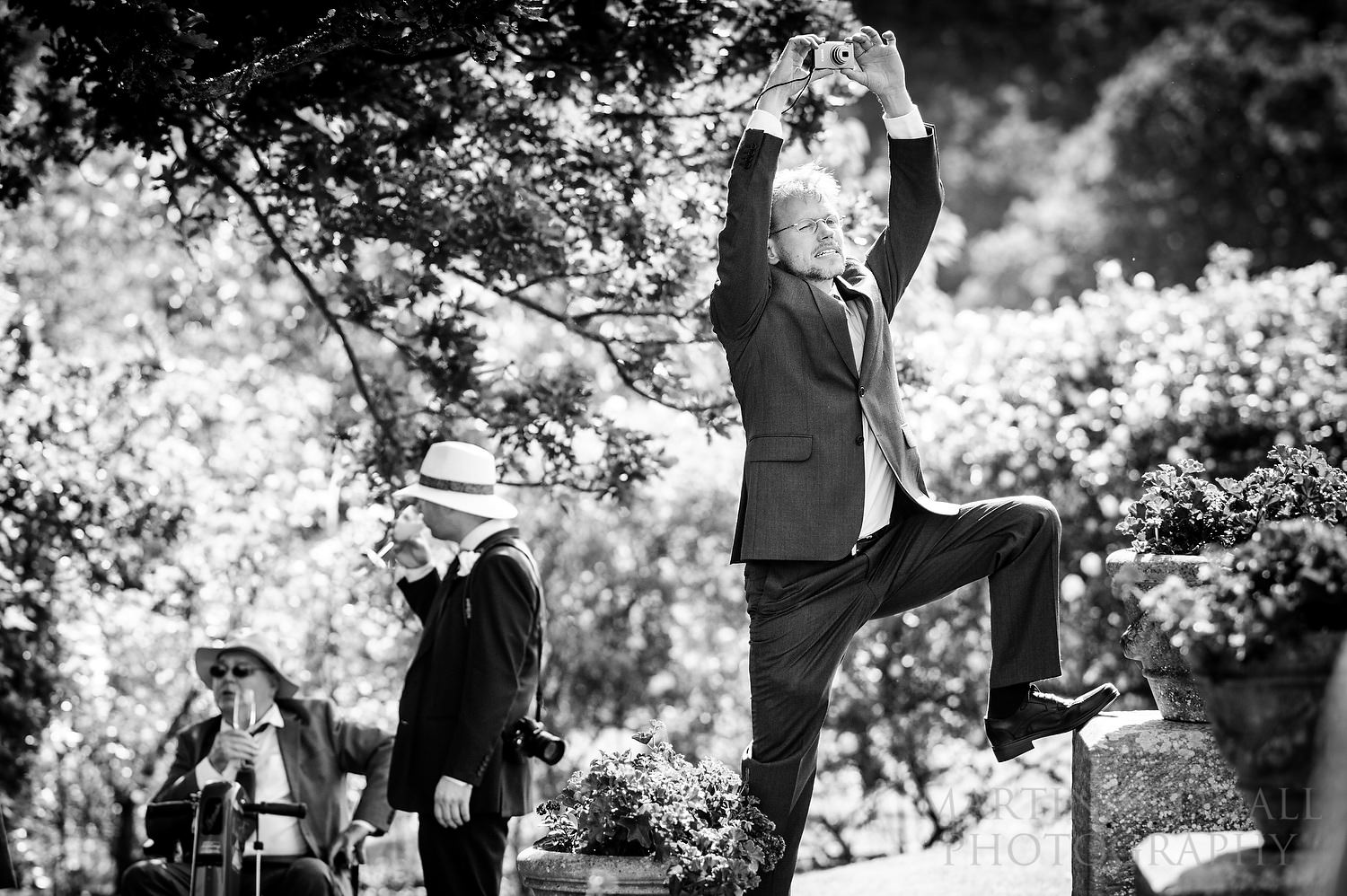 Wedding guest seeking the right camera angle