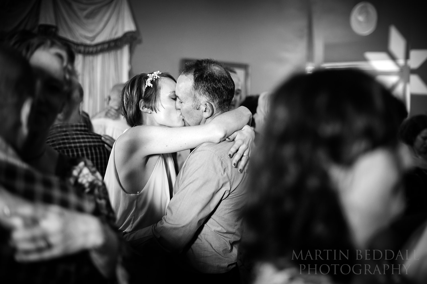 Bride and groom kiss