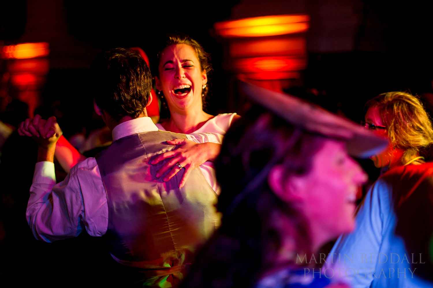 Bride dancing at wedding reception in Christ Church in Spitalfields