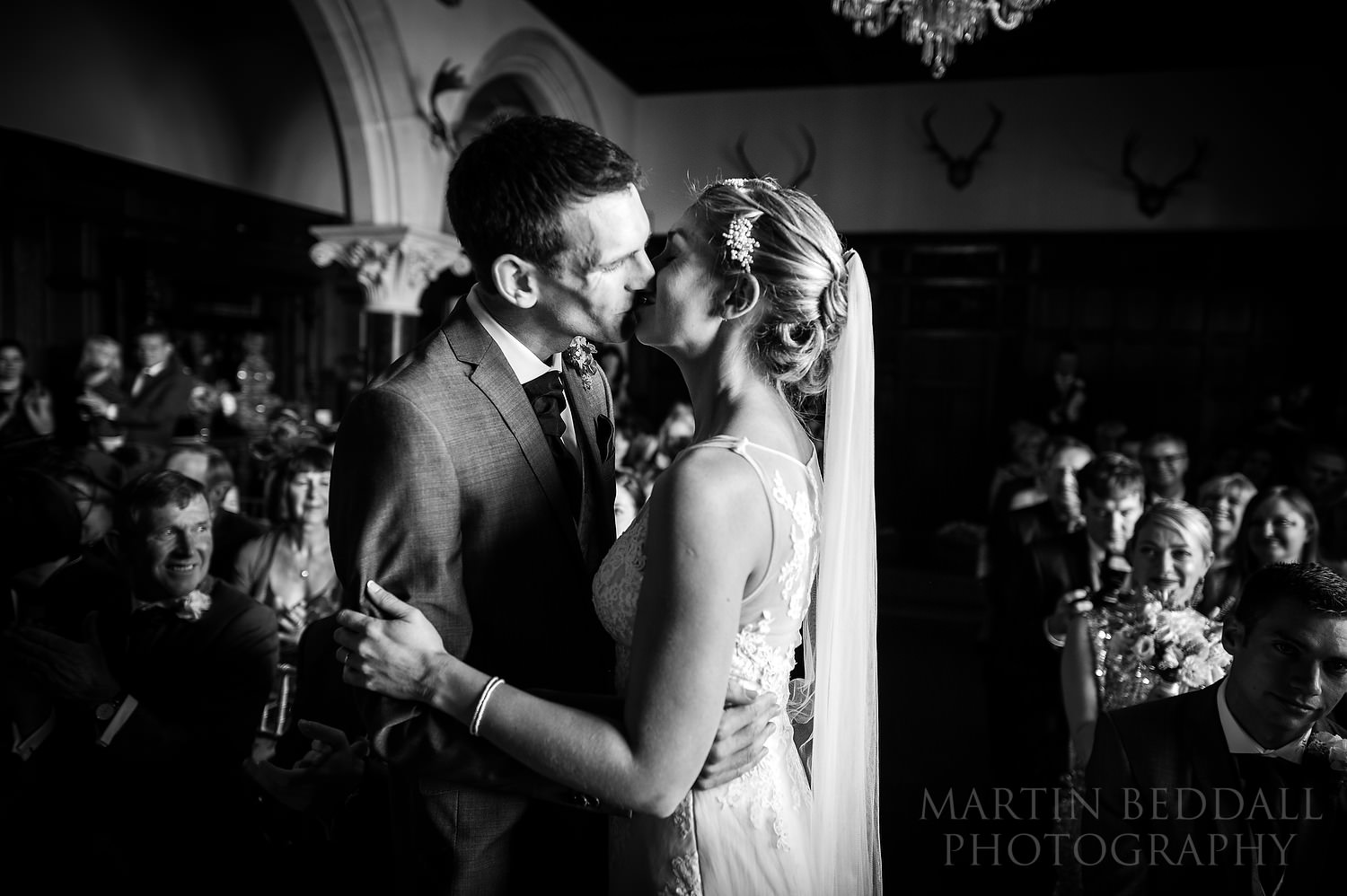 Bride and groom kiss at Huntsham Court wedding