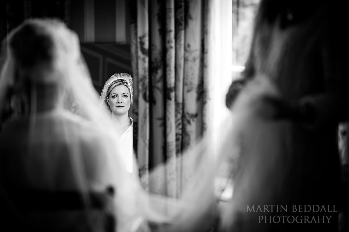 Bride checks how the veil looks on her
