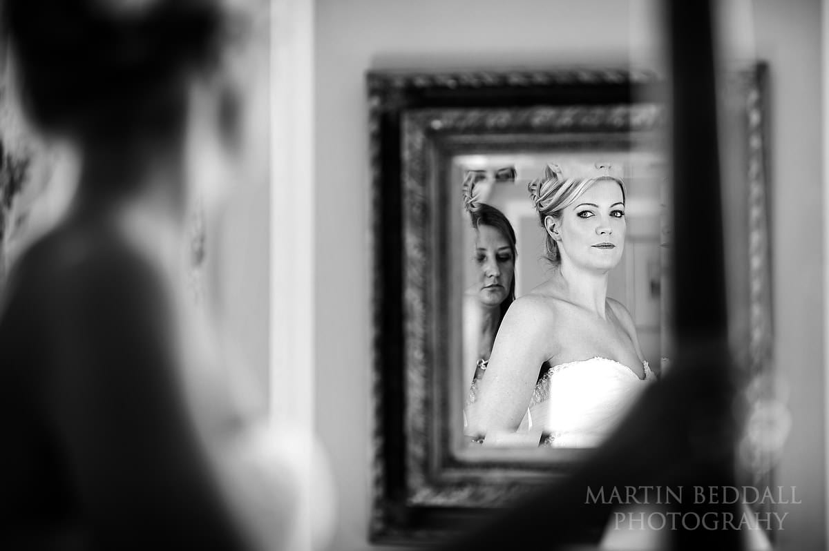 Bride looks in the mirror