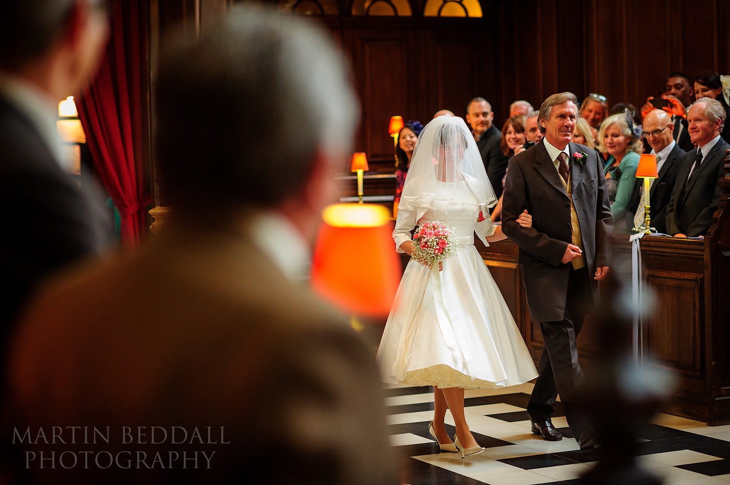 Bride walks in with her father at St Vedast alias Foster church