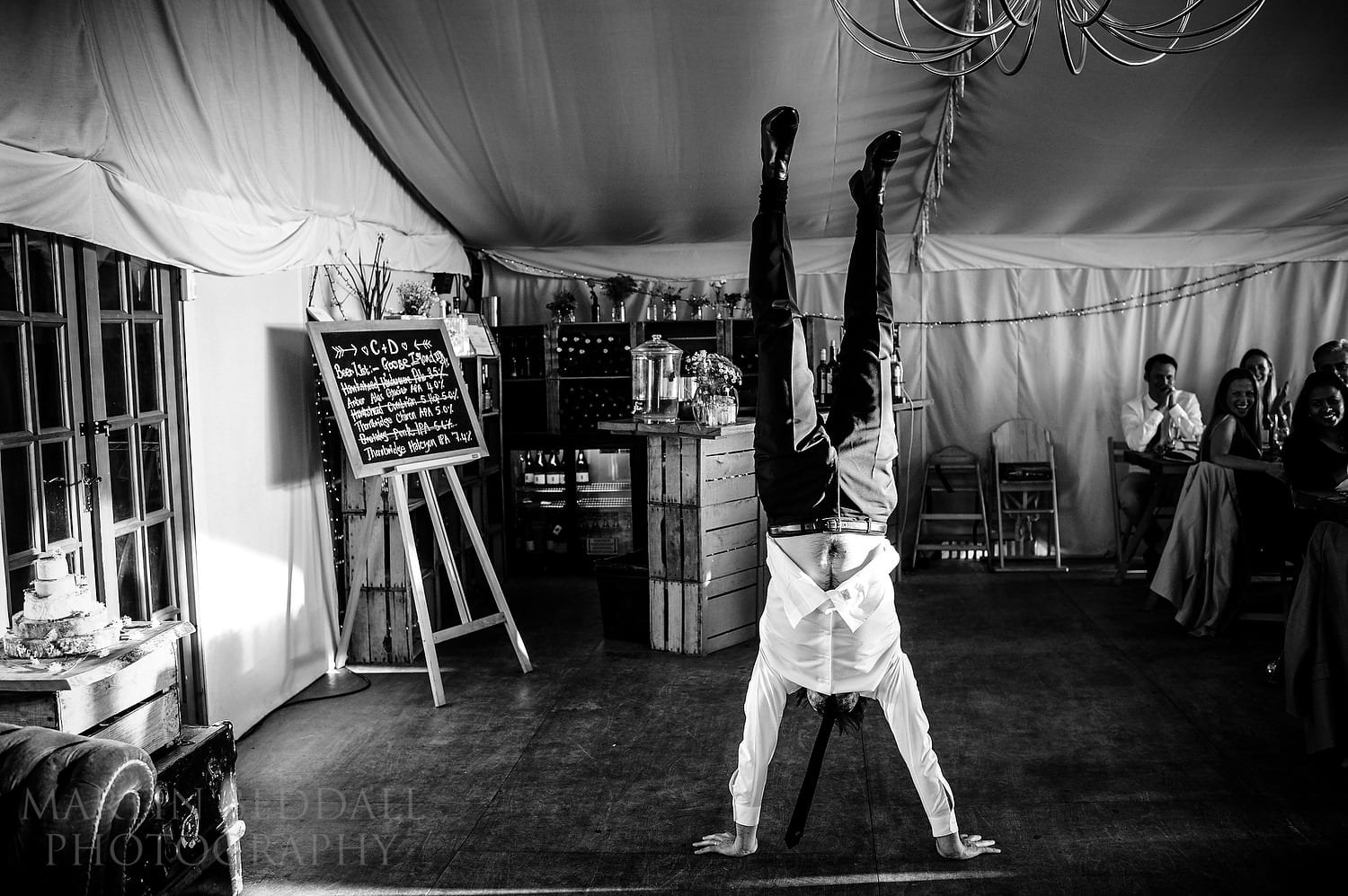 Groom does a handstand