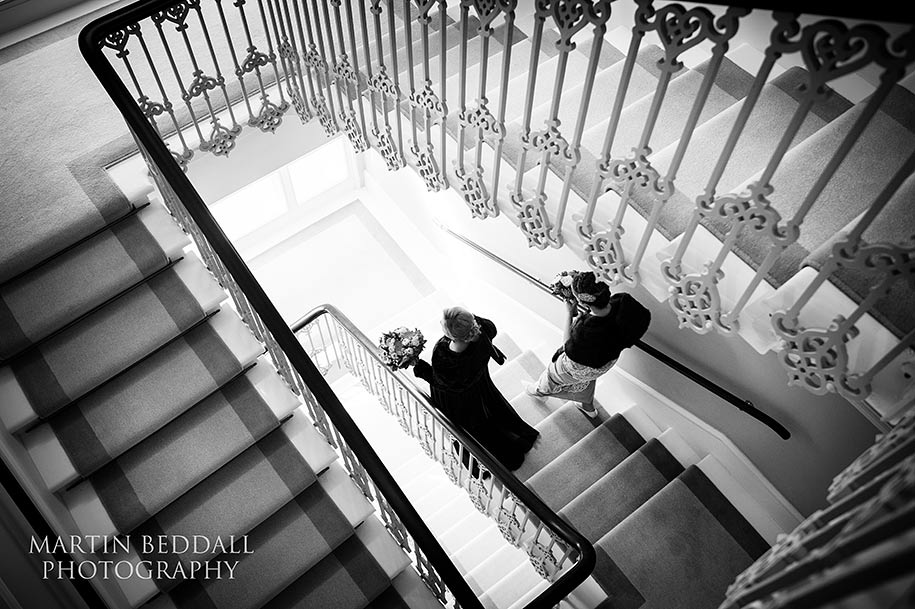 London female civil partnership The two brides walk down the hotel stairs