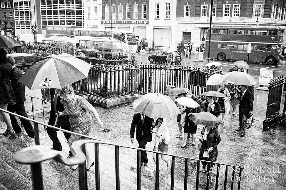 Wedding guests arrive at Spitalfields church