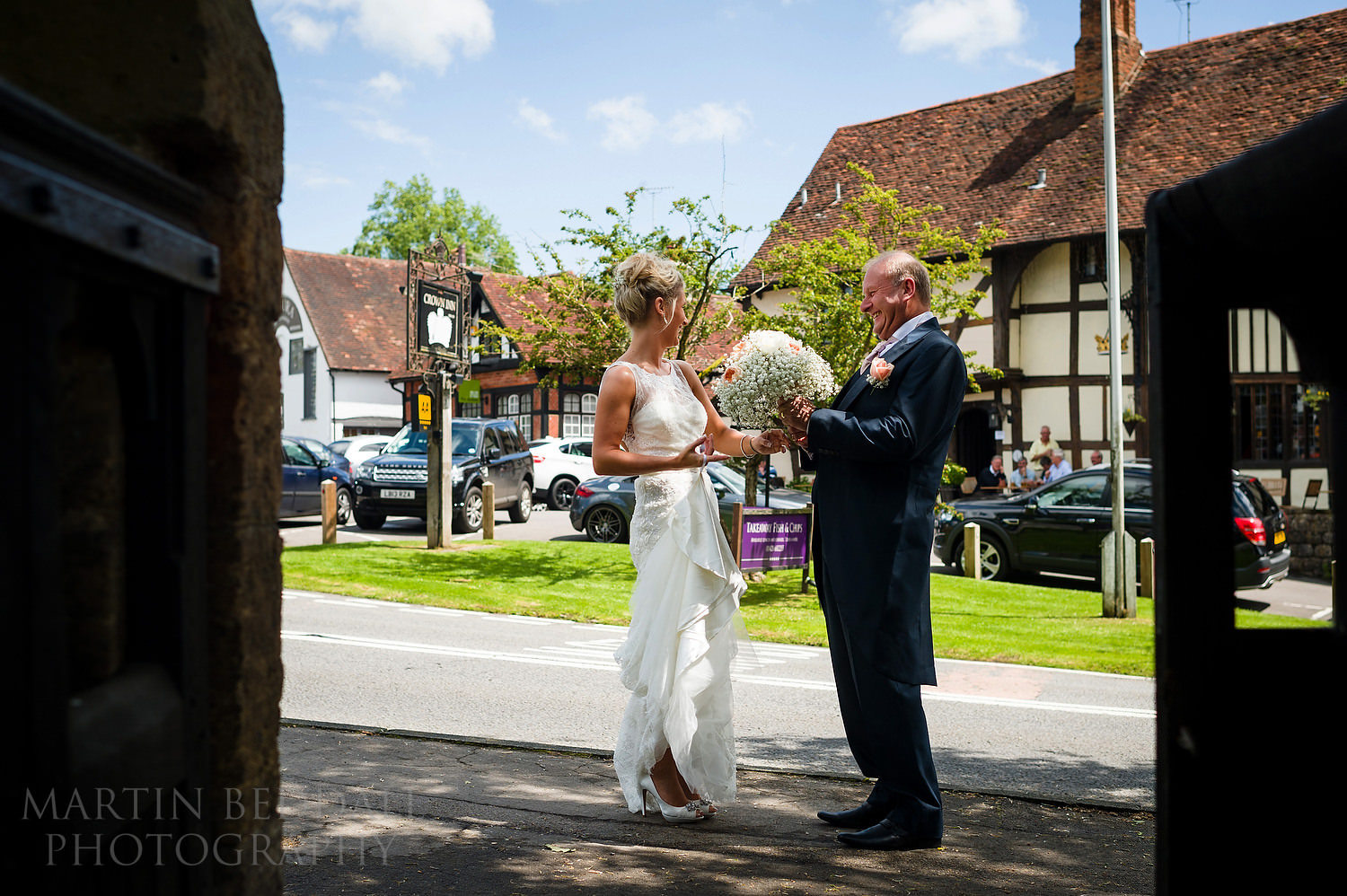 Bride and father banter with pub drinkers