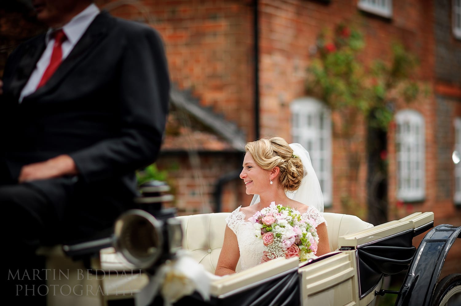 Bride arrives the church by horse and carriage