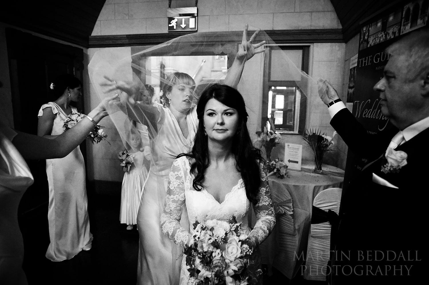 Arranging the bride's veil at Northampton Guildhall wedding