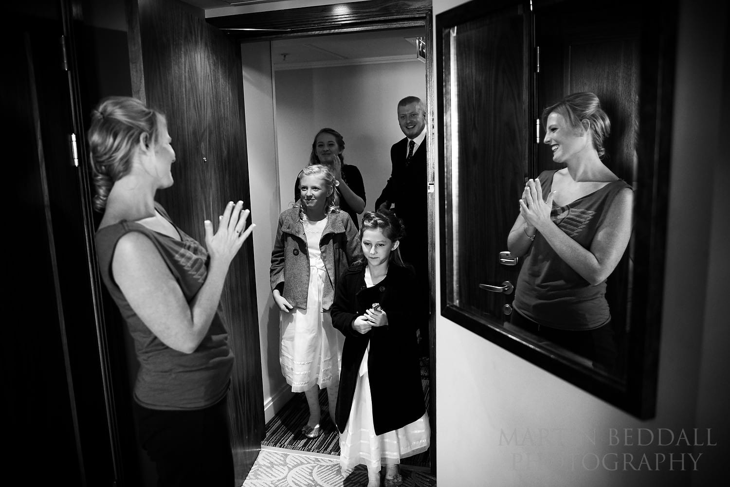 Bride greeting family to the hotel room
