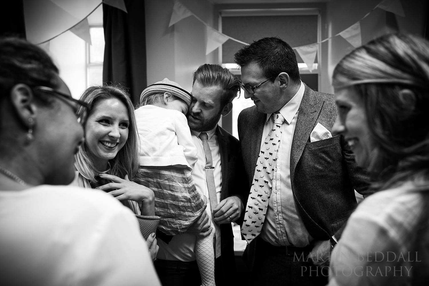 Guests gather in the hall before before the wedding ceremony