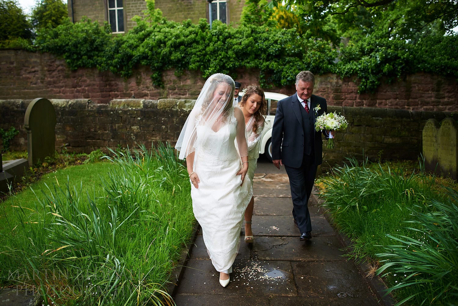 Bride arrives at the church for this Yorkshire wedding