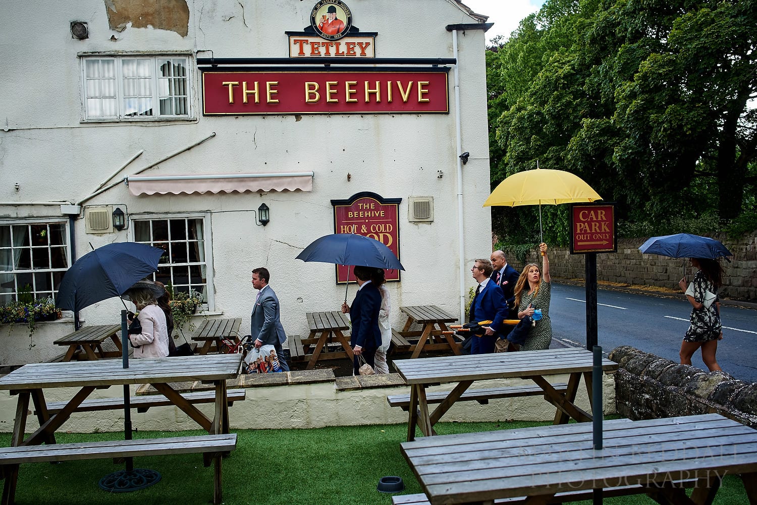 Wedding guests head to the reception in the pub garden at this Yorkshire wedding
