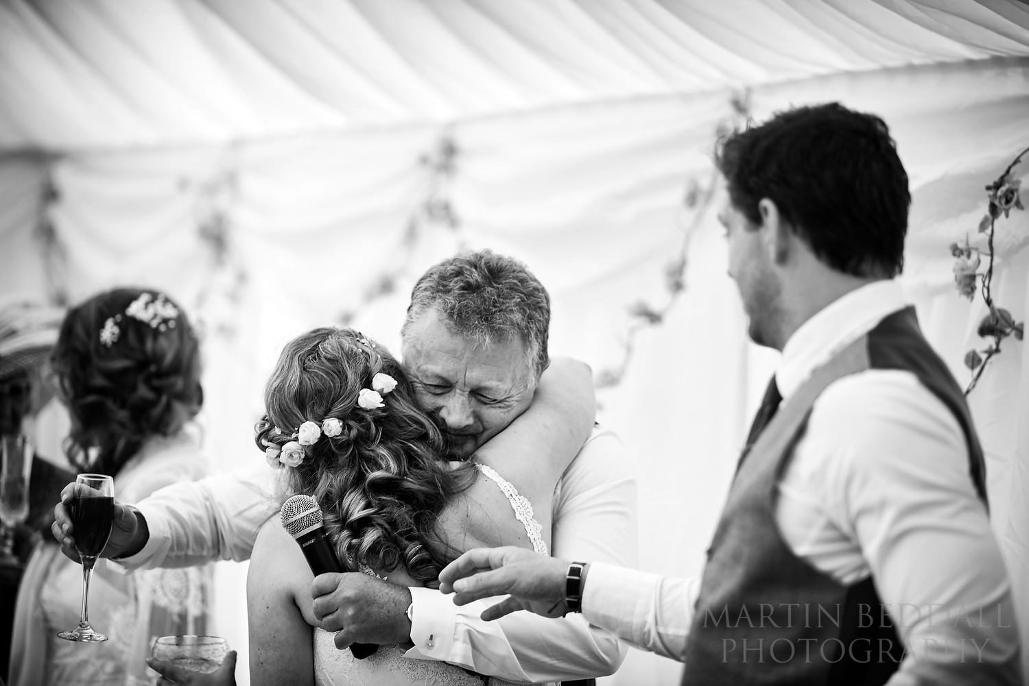 Bride hugs her father after his speech