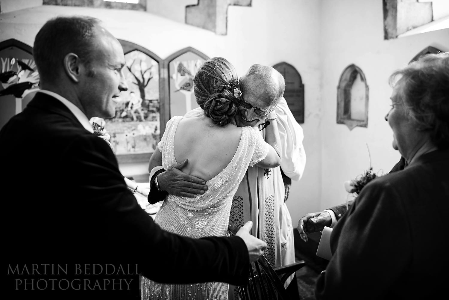 Hug for the bride from the vicar