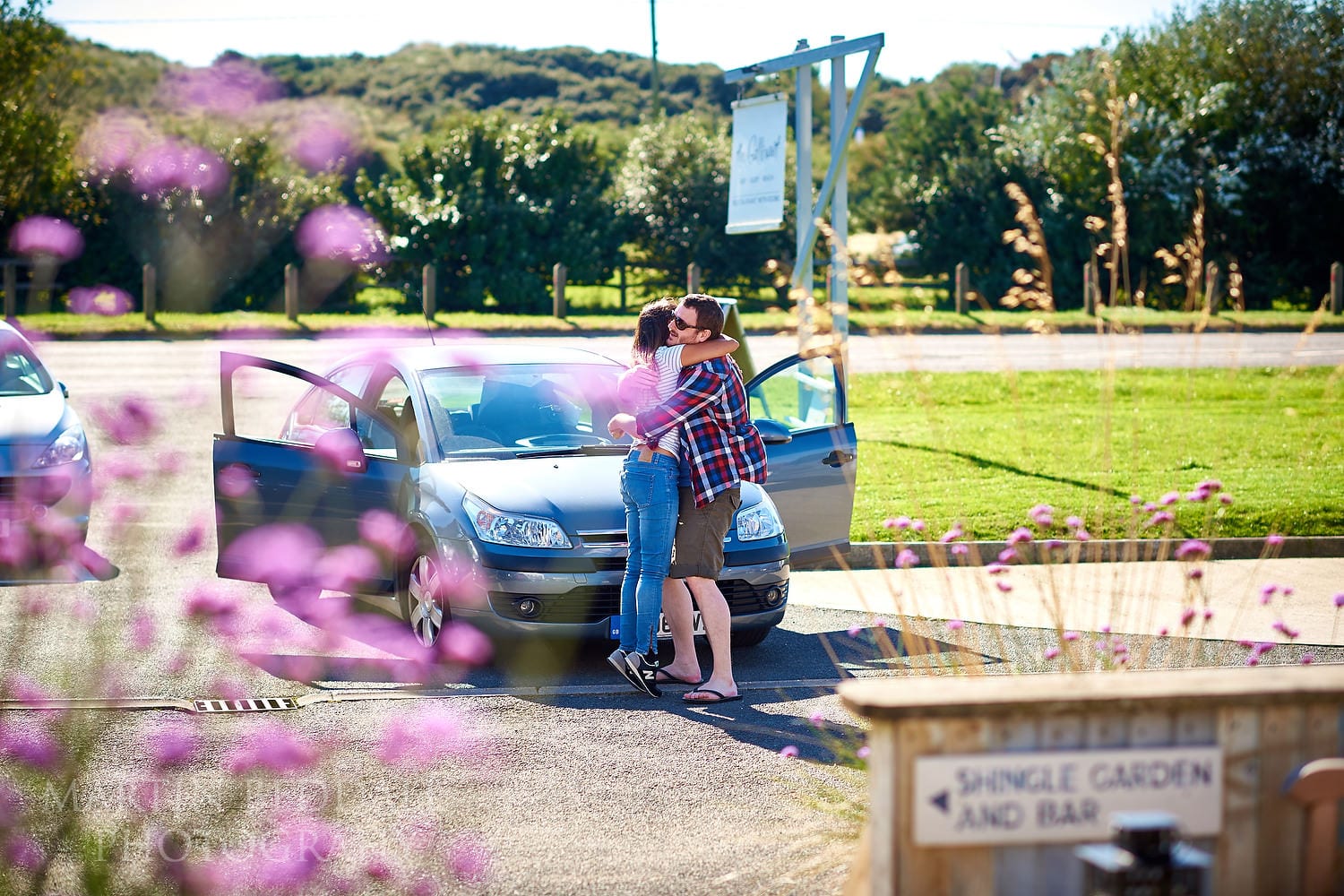 Groom greets a wedding guest in the Gallivant car park