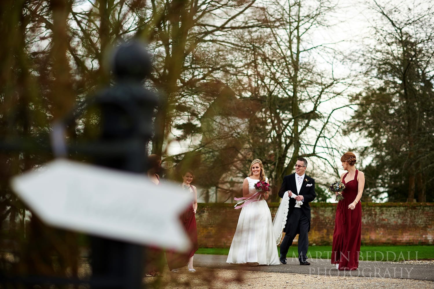 Bride walks to the wedding ceremony at Wasing Park