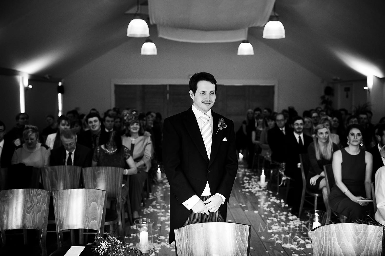 Groom waits in the ceremony room at Wasing Park