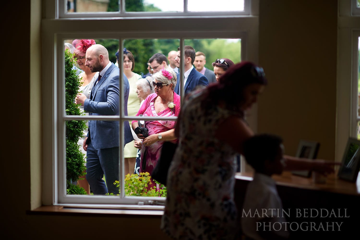 Guests head into the ceremony room at Braxted Park