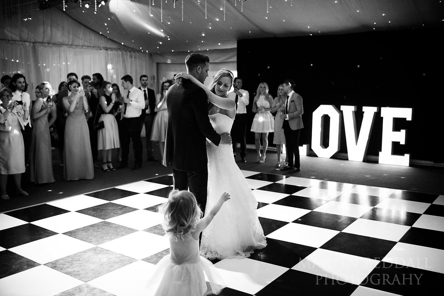 Their young daughter wants to join in the first dance