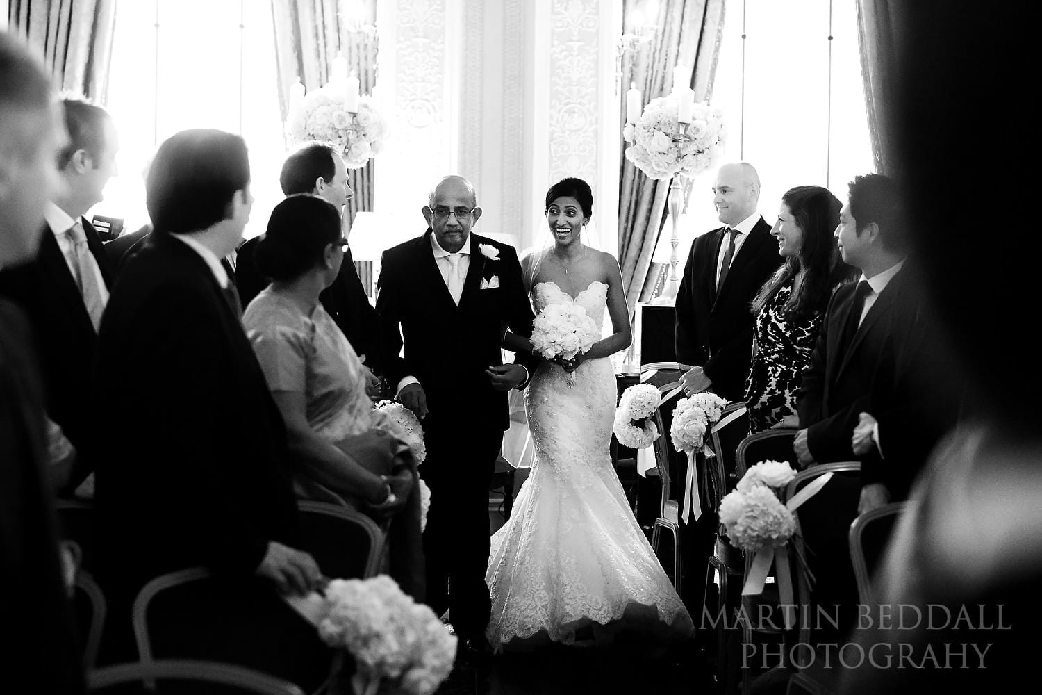 Bride and her father enter the ceremony room at the Lansdowne Club