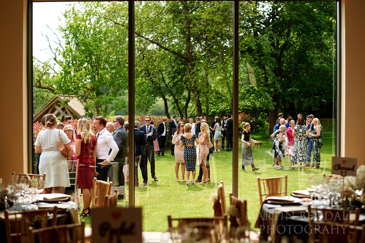 Guests on the lawn at Millbridge Court wedding reception