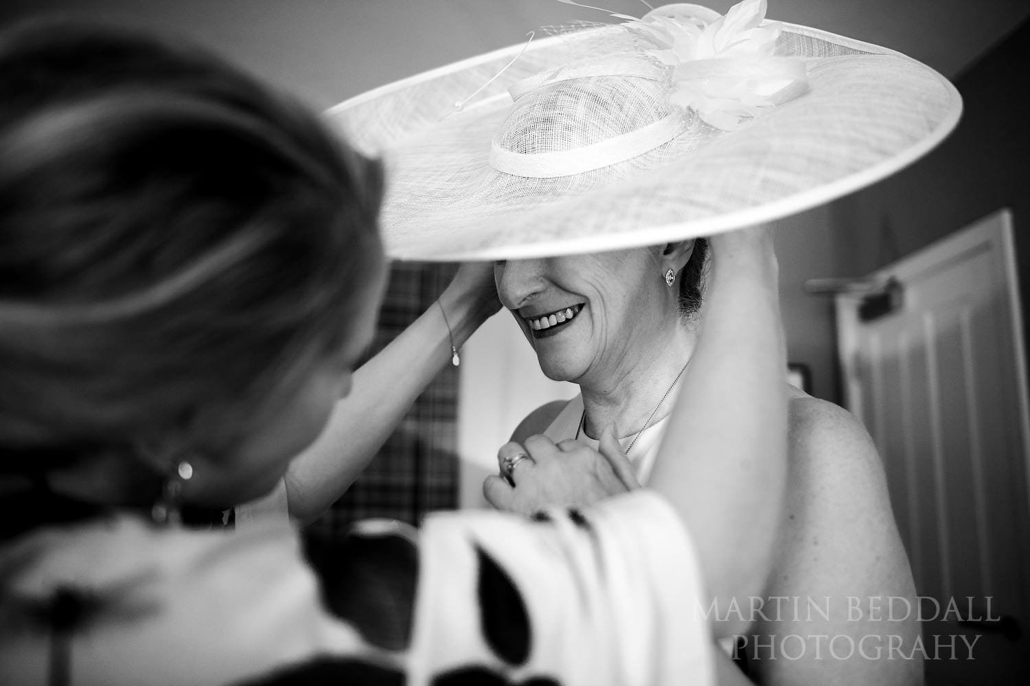 Adjusting the wedding hat