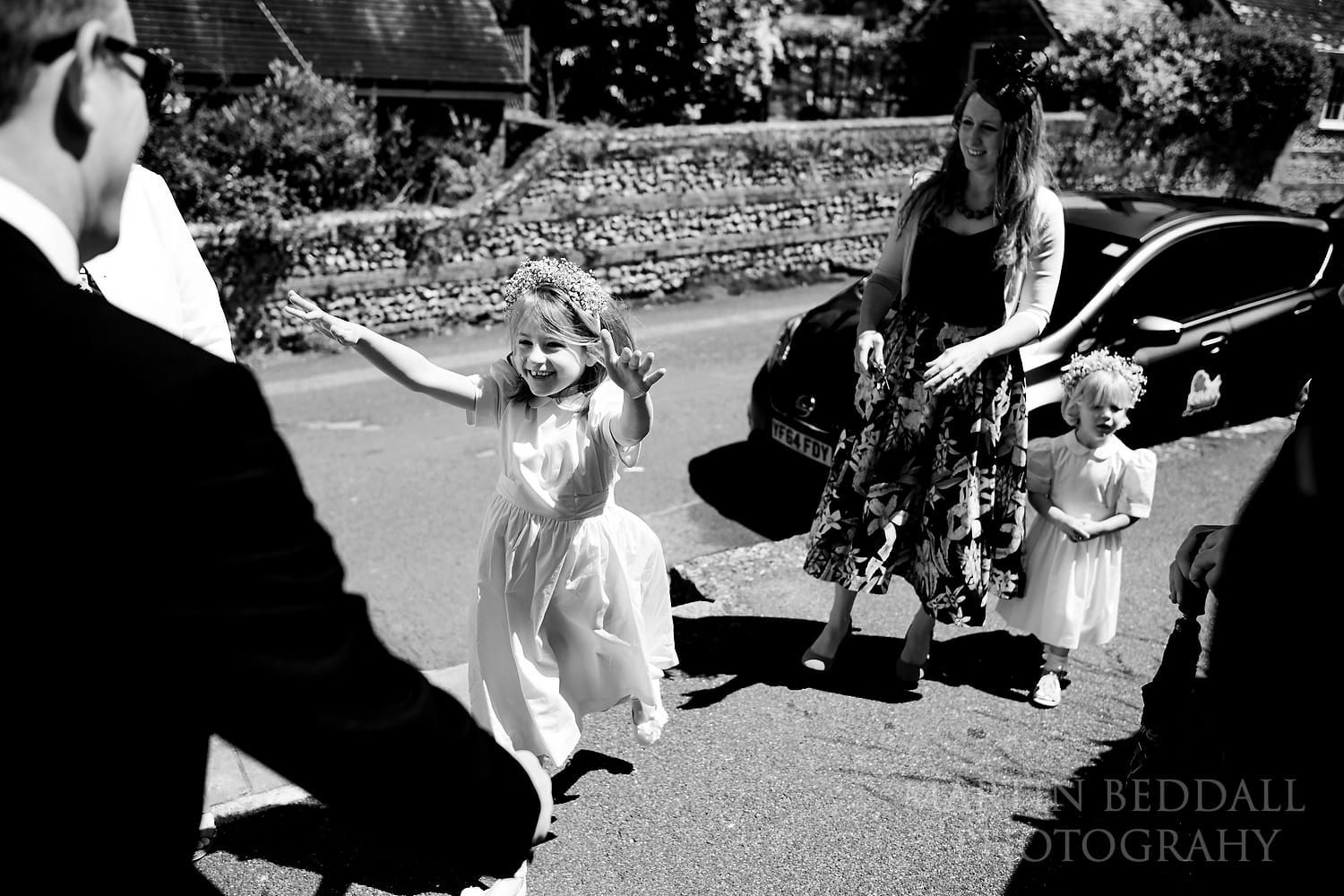 Flower girl greets her father