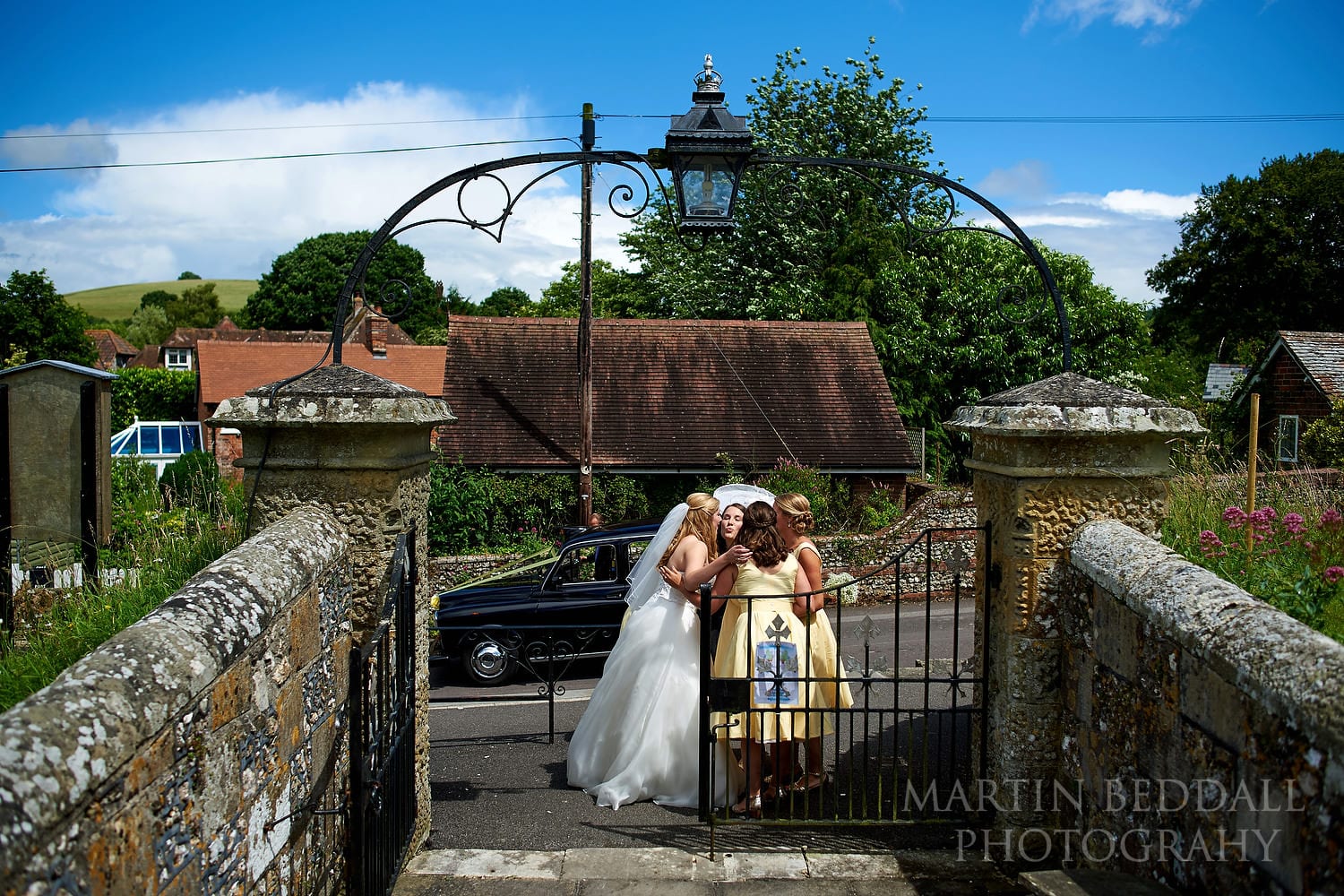 Final hug between the bride and her bridesmaids