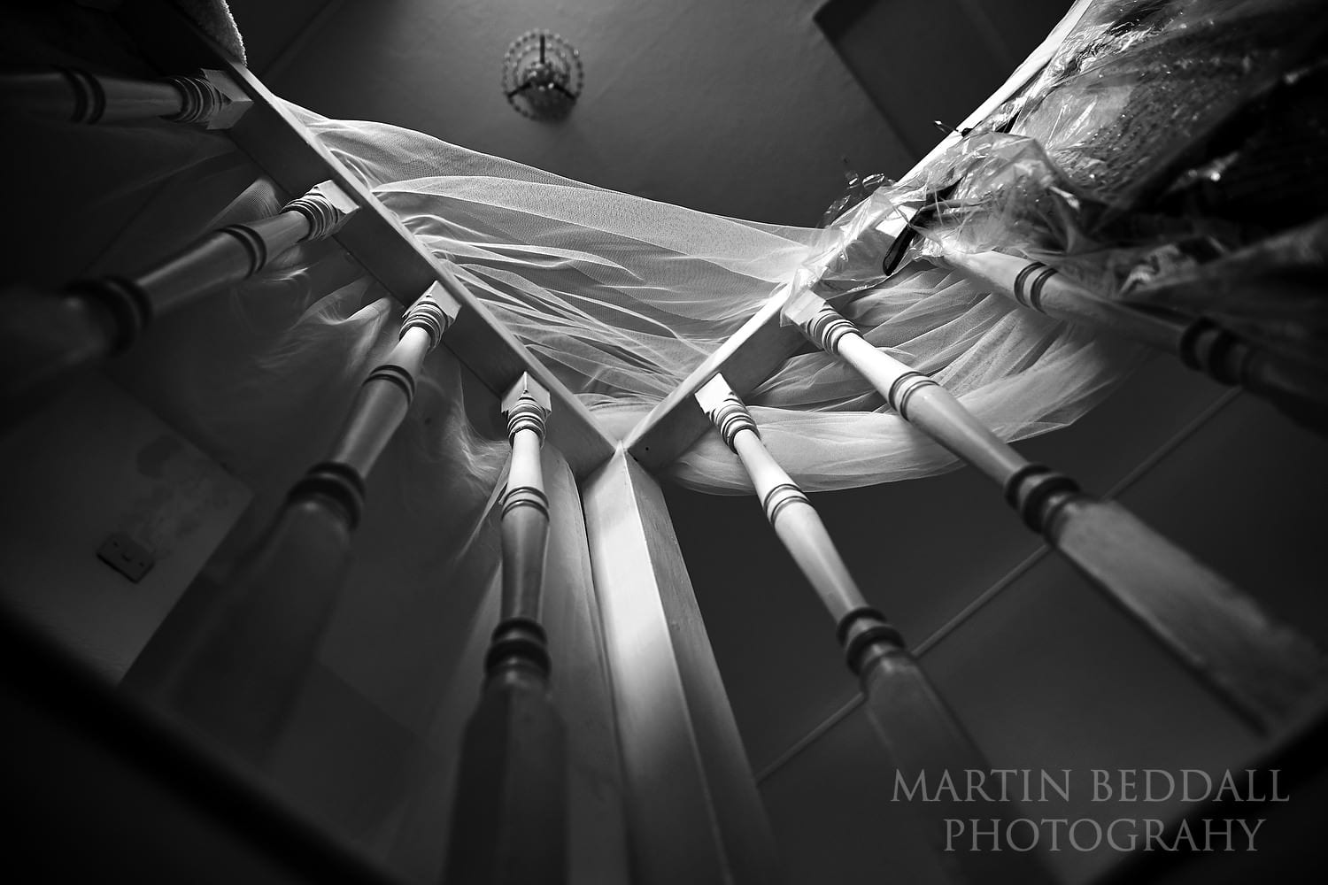 Bride's veil hanging on the bannister