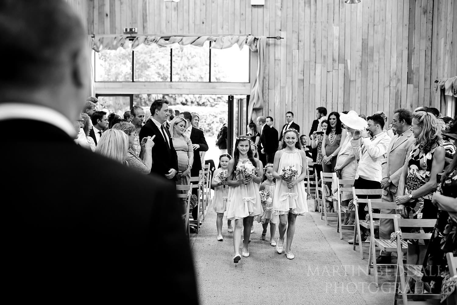 Flower girls in the aisle at Chafford Park wedding