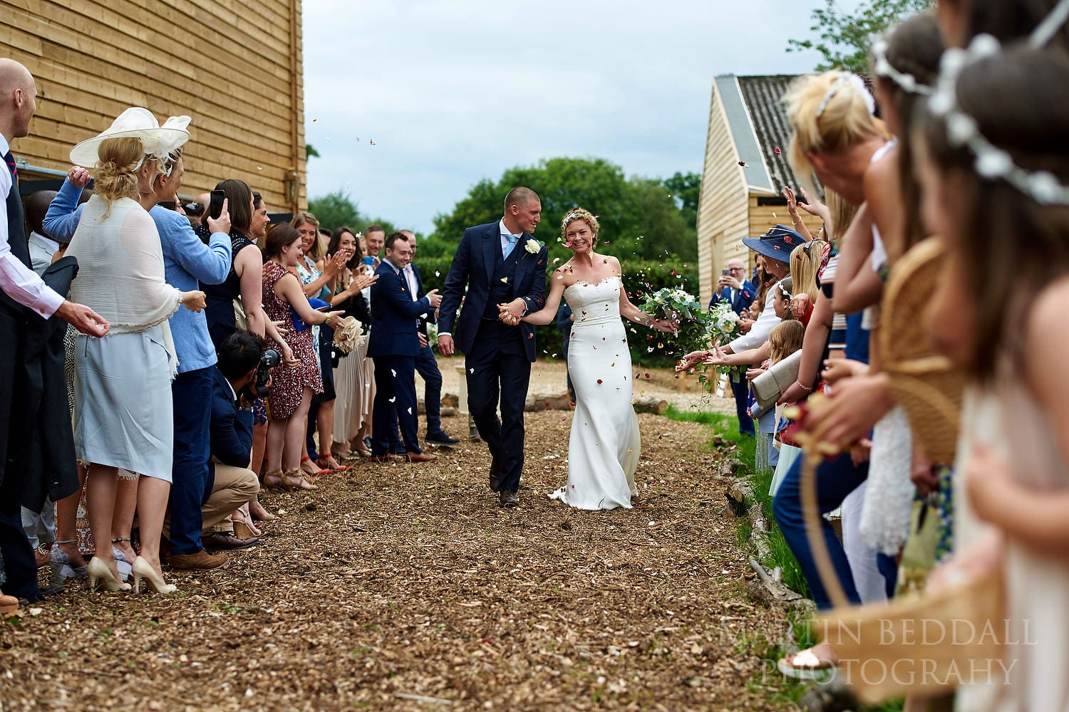 Confetti run at Chafford Park wedding